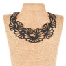 Paguro Upcycle black floral statement necklace displayed on straw mannequin upcycled vegan flower necklace