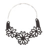 Paguro Upcycle upcycled inner tube necklace with black floral cutout design and silver chain