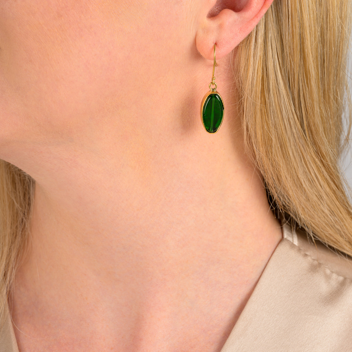 Paguro Upcycle green recycled glass earrings with gold hooks worn on ear