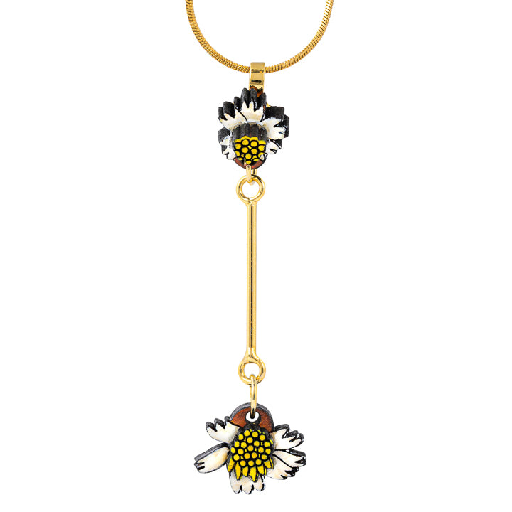 Paguro Upcycle reclaimed wood necklace with black white and yellow flower design on gold chain