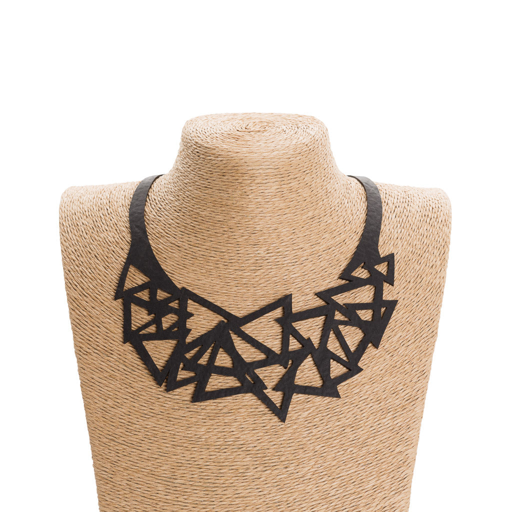 Paguro Upcycle black geometric recycled necklace with interlocking triangle shapes on display bust