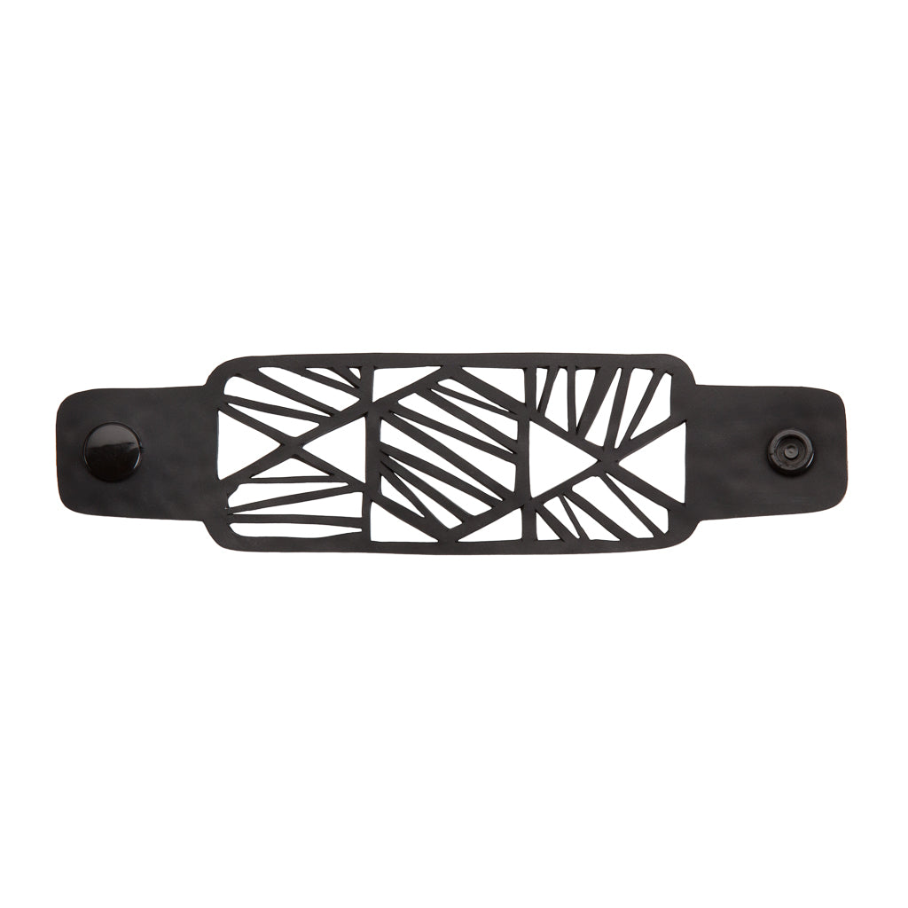 Paguro Upcycle black recycled rubber bracelet with geometric cutout design and snap closure