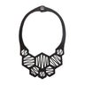 Paguro Upcycle black geometric recycled rubber necklace with honeycomb cutout and snap closure