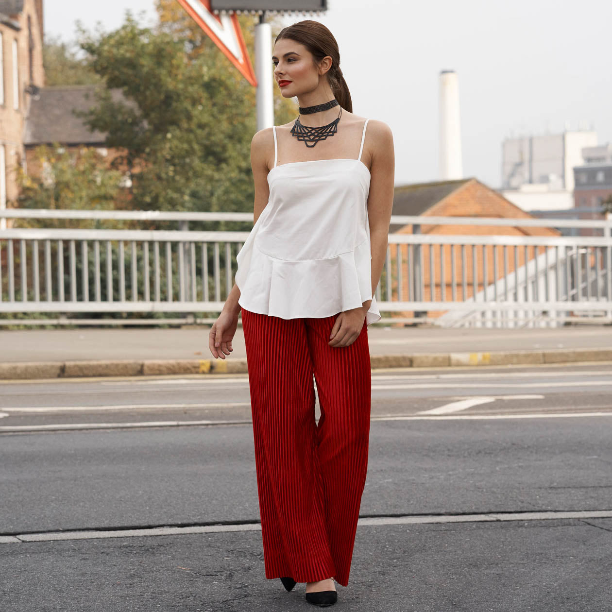 Paguro Upcycle model wearing upcycled inner tube necklace black layered choker on city street