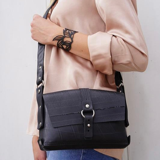 Paguro Upcycle recycle rubber vegan handbag worn across the body with stylish design and adjustable strap
