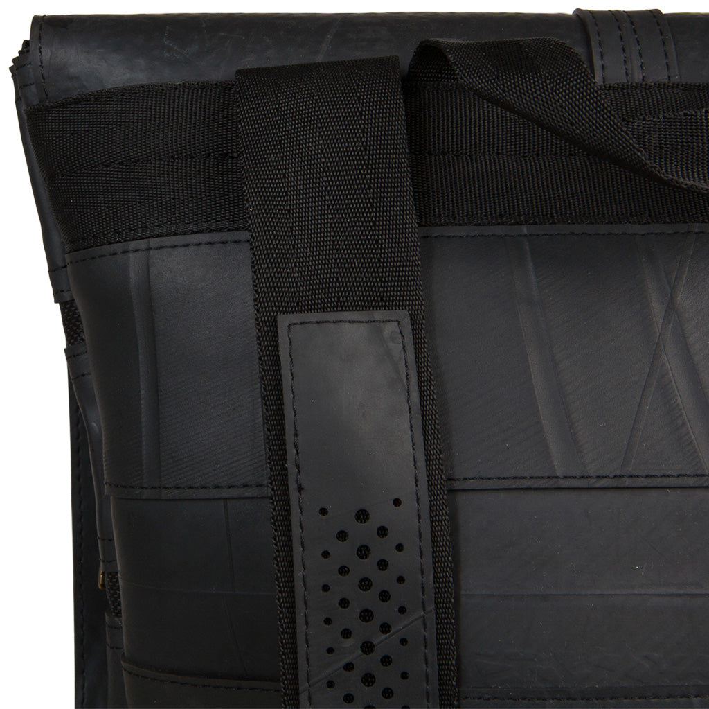 Close-up of Paguro Upcycle black vegan inner tube backpack strap and material details