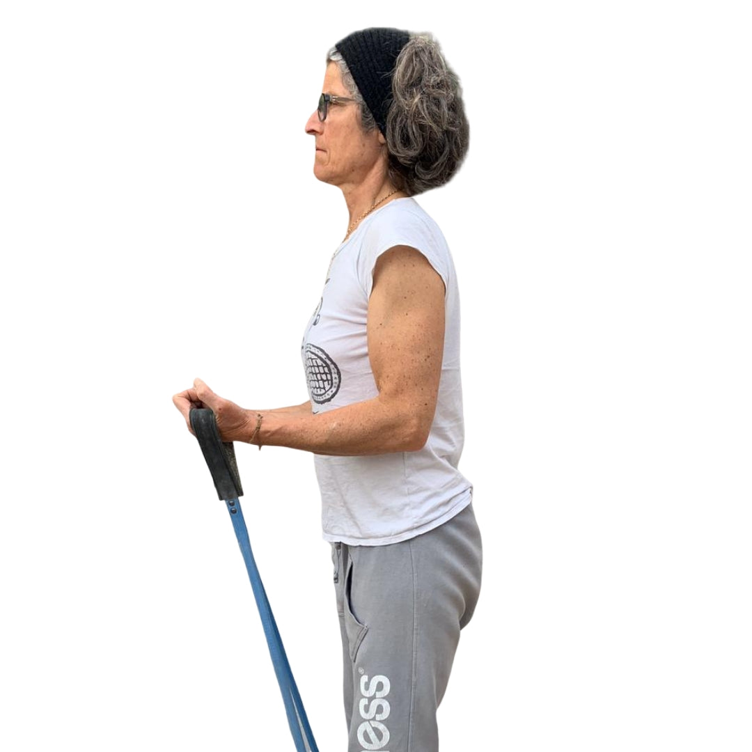Woman using a blue upcycled resistance band for strength training exercises by Paguro Upcycle